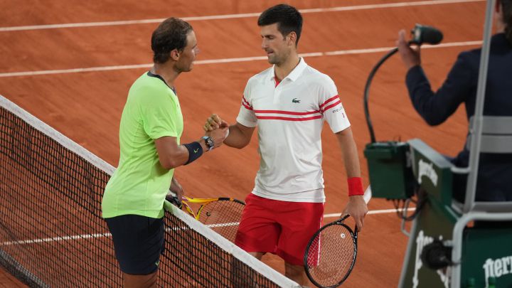 Rafa Nadal and Novak Djokovic greet each other after their semi-final match at Roland Garros.