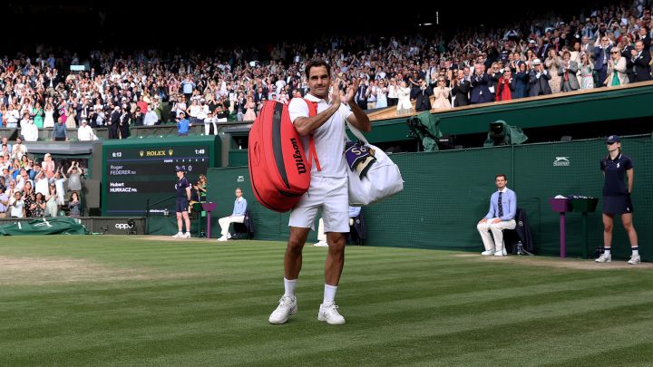 Roger Federer bids farewell to the Wimbledon crowd following his quarter-final loss to Hubert Hurkacz in the 2021 edition.