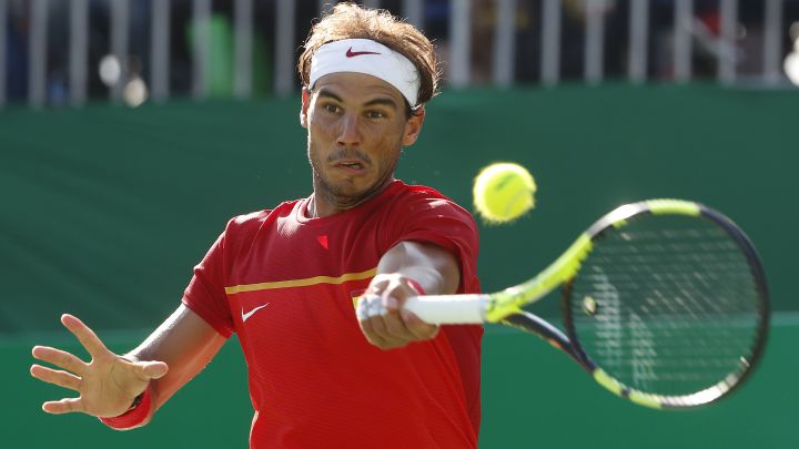 Rafa Nadal returns a ball during his match against Kei Nishikori for the individual bronze medal at the 2016 Rio Olympics.