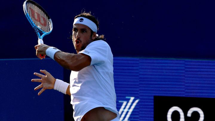 Feliciano Lopez returns a ball during his match against Lucas Pouille at the Winston-Salem Open at the Wake Forest Tennis Complex in Winston Salem, North Carolina.