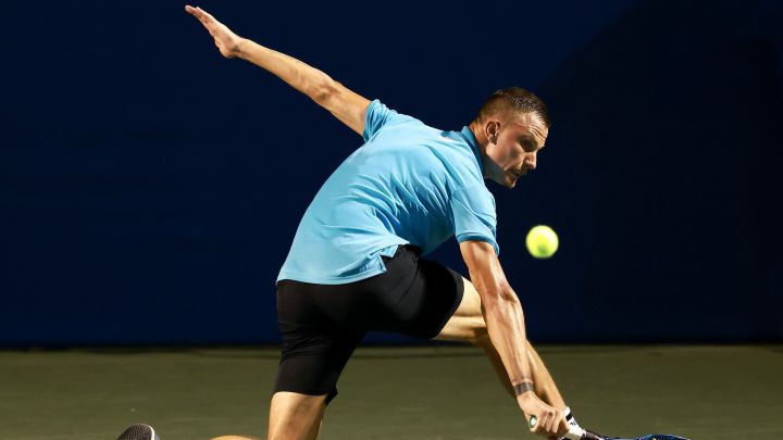 Marton Fucsovics returns a ball during his match against Carlos Alcaraz in the second round of the Winston-Salem Open at the Wake Forest Tennis Complex in Winston Salem, North Carolina.