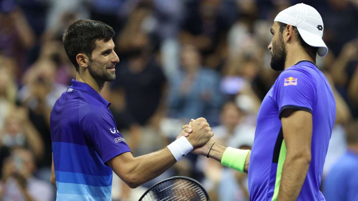 Novak Djokovic and Matteo Berrettini greet each other after their US Open quarterfinal match at the USTA Billie Jean King National Tennis Center in New York.