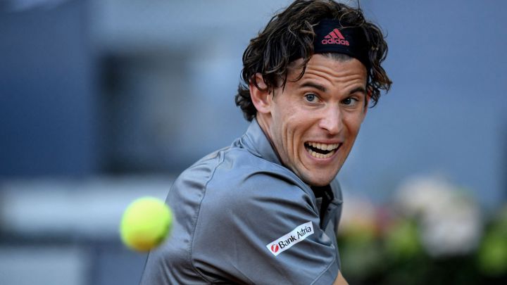 Austrian tennis player Dominic Thiem returns a ball during a match at the 2021 Mutua Madrid Open.