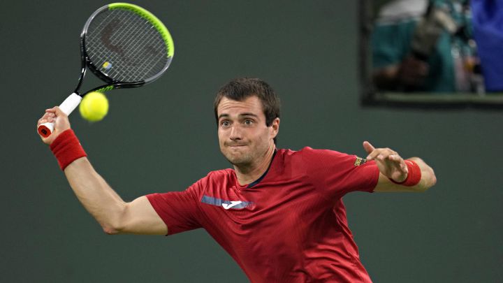 Spanish tennis player Pedro Martínez returns a ball during his match against Stefanos Tsitsipas at the BNP Paribas Open, the Indian Wells Masters 1,000, at the Indian Wells Tennis Garden in Indian Wells, California.