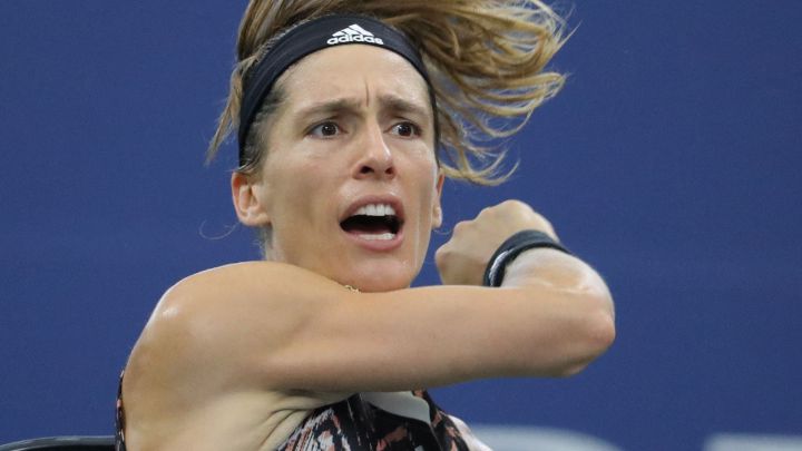 German tennis player Andrea Petkovic returns a ball during her match against Garbiñe Muguruza at the 2021 US Open.