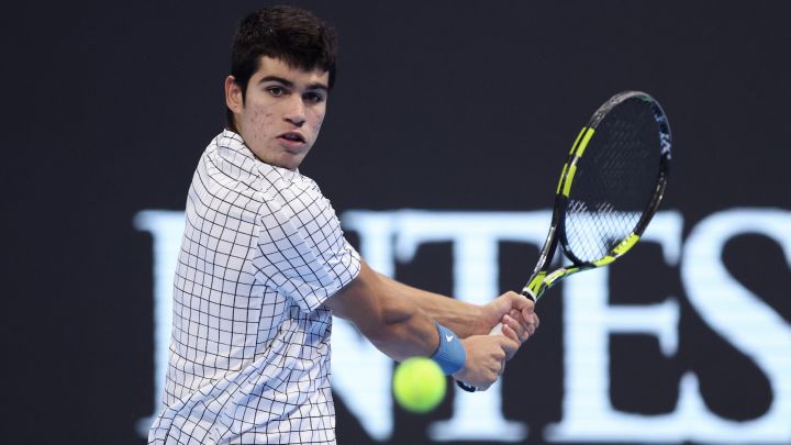 MILAN, ITALY - NOVEMBER 09:  Carlos Alcaraz of Spain in his round robin match against Holger Vitus Nodskov Rune of Denmark during Day One of the Next Gen ATP Finals at Palalido Stadium on November 09, 2021 in Milan, Italy. (Photo by Julian Finney/Getty Images)