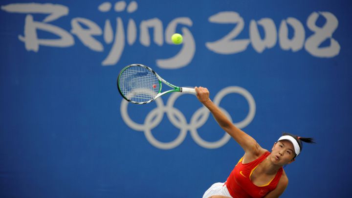 Chinese tennis player Peng Shuai serves during her match against Carla Suarez at the 2008 Beijing Olympics.