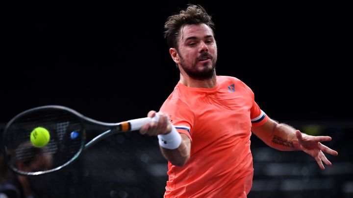 Swiss tennis player Stanislas Wawrinka returns a ball during his match against Alexander Zverev at the 2020 Paris Masters 1,000.