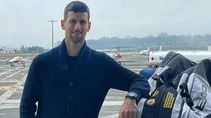 Serbian tennis player Novak Djokovic poses before boarding his flight to Melbourne for the 2022 Australian Open.