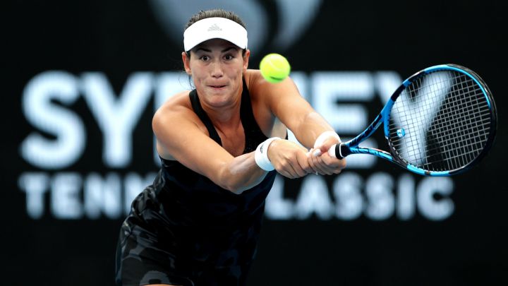 SYDNEY, AUSTRALIA - JANUARY 12: Garbine Muguruza of Spain plays a backhand in her match against Ekaterina Alexandrova of Russia during day four of the Sydney Tennis Classic at the Sydney Olympic Park Tennis Centre on January 12, 2022 in Sydney, Australia. (Photo by Brendon Thorne/Getty Images)