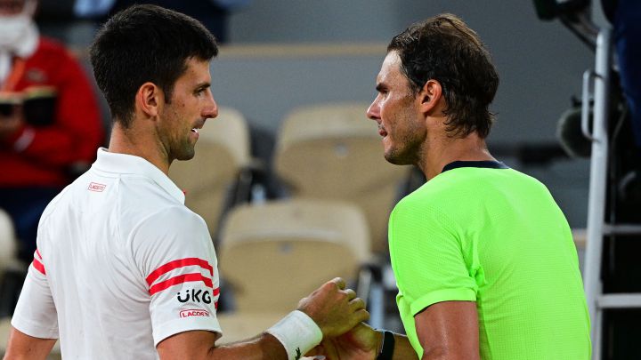 Serbian tennis player Novak Djokovic and Spanish tennis player Rafa Nadal pose before their 2021 Roland Garros semifinal match.