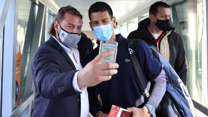 A man takes a selfie with Novak Djokovic after his arrival at Belgrade's Nikola Tesla airport after being deported from Australia.