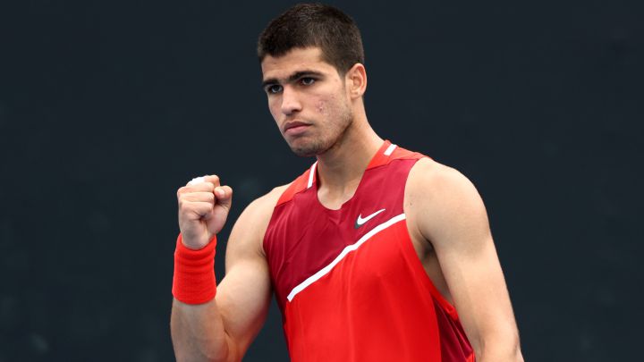 MELBOURNE, AUSTRALIA - JANUARY 17: Carlos Alcaraz of Spain celebrates after winning a point in his first round singles match against Alejandro Tabilo of Chile during day one of the 2022 Australian Open at Melbourne Park on January 17, 2022 in Melbourne, Australia. (Photo by Clive Brunskill/Getty Images)