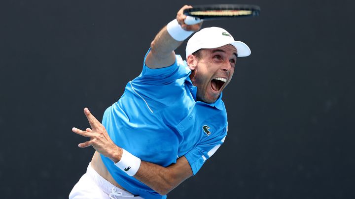 MELBOURNE, AUSTRALIA - JANUARY 18: Roberto Bautista Agut of Spain serves in his first round singles match against Stefano Travaglia of Italy during day two of the 2022 Australian Open at Melbourne Park on January 18, 2022 in Melbourne, Australia. (Photo by Mark Metcalfe/Getty Images)