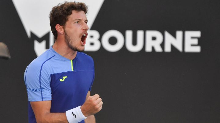 Spain's Pablo Carreno Busta reacts as he plays against Sebastian Korda of the US during their men's singles match on day five of the Australian Open tennis tournament in Melbourne on January 21, 2022. (Photo by Paul Crock / AFP) / -- IMAGE RESTRICTED TO EDITORIAL USE - STRICTLY NO COMMERCIAL USE --