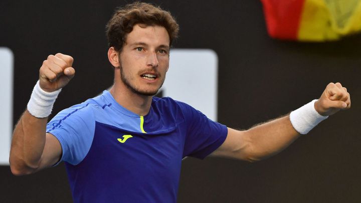 Spain's Pablo Carreno Busta celebrates after beating Sebastian Korda of the US in their men's singles match on day five of the Australian Open tennis tournament in Melbourne on January 21, 2022. (Photo by Paul Crock / AFP) / -- IMAGE RESTRICTED TO EDITORIAL USE - STRICTLY NO COMMERCIAL USE --