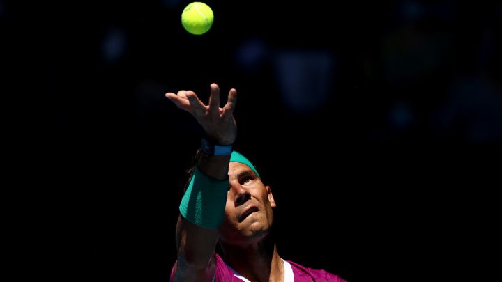 MELBOURNE, AUSTRALIA - JANUARY 26: Rafael Nadal of Spain serves in his Men's Singles Quarterfinals match against Denis Shapovalov of Canada during day nine of the 2022 Australian Open at Melbourne Park on January 25, 2022 in Melbourne, Australia.  (Photo by Mark Metcalfe/Getty Images)