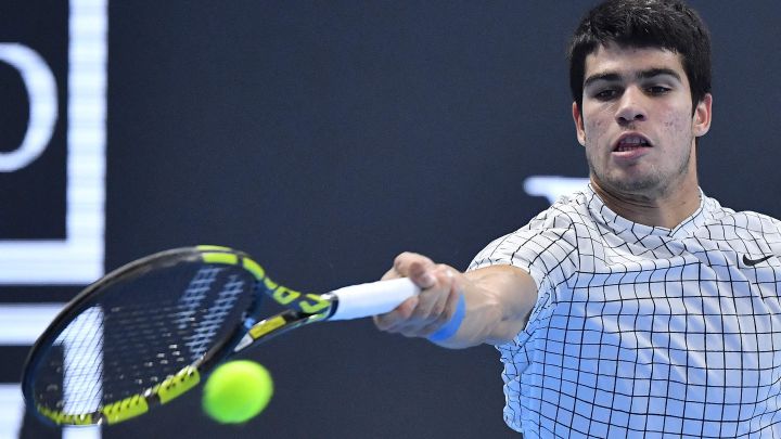 Spanish tennis player Carlos Alcaraz returns a ball during his match against Sebastian Korda in the final of the NextGen ATP Finals 2021 in Milan.