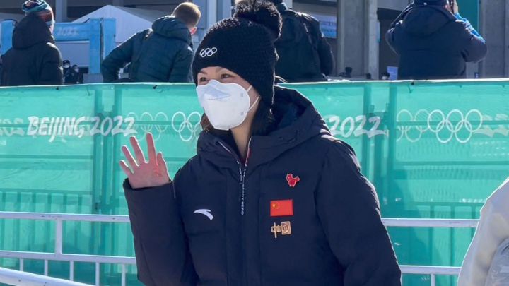 Chinese tennis player Peng Shuai waves during the Women's Big Air Final at the Beijing 2022 Winter Olympics.