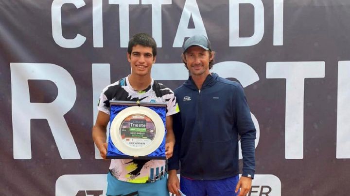 Spanish tennis player Carlos Alcaraz and his coach Juan Carlos Ferrero pose after winning the title of the Città di Trieste Trophy of the ATP Challenger Tour.
