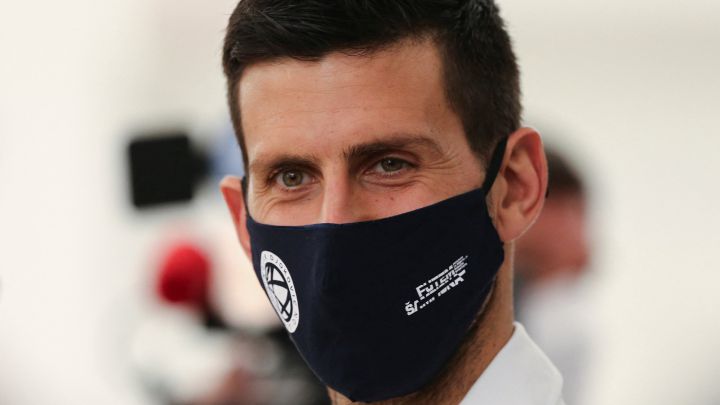 Serbian tennis player Novak Djokovic poses with a face mask at the Serbian Pavilion at Expo 2020 in Dubai.