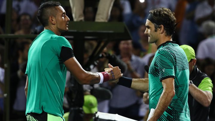 Australian tennis player Nick Kyrgios greets Roger Federer after their match at the 2017 Miami Open.