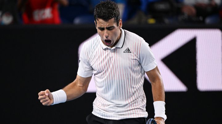 Spanish tennis player Jaume Munar celebrates a point during his match against Aslan Karatsev at the Australian Open 2022.