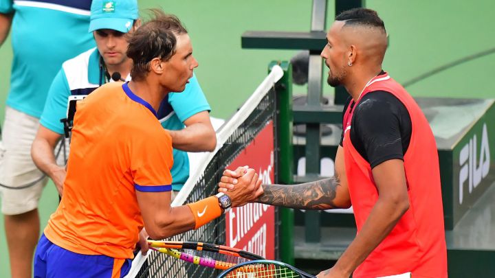 Spain's Rafael Nadal shakes hands with Australia's Nick Kyrgios at the net after their ATP quarterfinal match at the Indian Wells tennis tournament on March 17, 2022 in Indian Wells, California.  - Nadal defeated Kyrgios 7-6(0), 5-7, 6-4.  (Photo by Frederic J. BROWN / AFP)