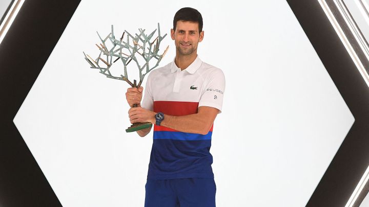 Serbian tennis player Novak Djokovic poses with the Paris 2021 Masters 1,000 champion trophy after beating Daniil Medvedev in the final.