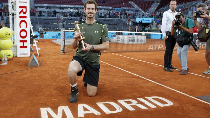 British tennis player Andy Murray poses with the 2015 Mutua Madrid Open champion trophy after beating Rafa Nadal in the final.