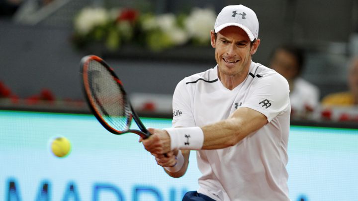 British tennis player Andy Murray returns a ball during his match against Borna Coric at the 2017 Mutua Madrid Open.