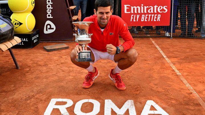 Serbian tennis player Novak Djokovic poses with the title of champion of the Masters 1,000 in Rome 2022.