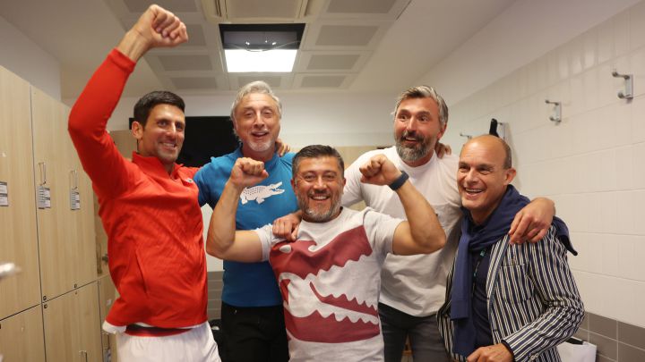 ROME, ITALY - MAY 15: Novak Djokovic of Serbia celebrates with the Internazionali BNL D'Italia Men's Single's winners trophy alongside Fitness Trainer Marco Panichi, Agent Edoardo Artaldi, Coach Goran Ivanisevic and Physio Ulises Badio after their victory against Stefanos Tsitsipas of Greece during the Men's Single's Final on Day 8 of the Internazionali BNL D'Italia at Foro Italico on May 15, 2022 in Rome, Italy.  (Photo by Julian Finney/Getty Images)