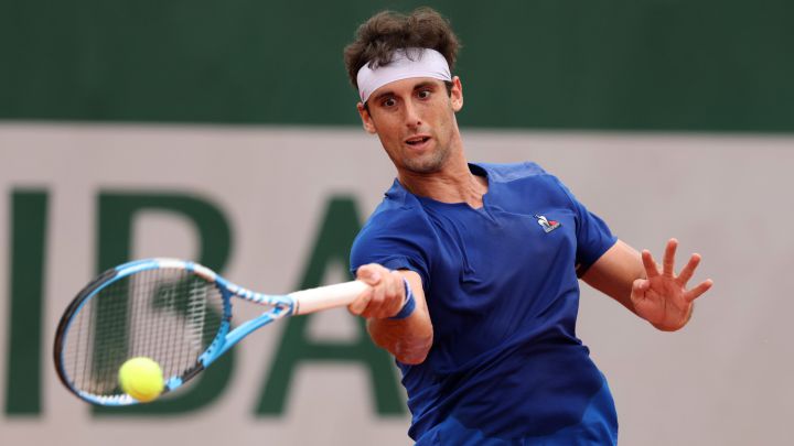 PARIS, FRANCE - MAY 22: Carlos Taberner of Spain plays a forehand against Borna Coric of Croatia in their first round match during the 2022 French Open at Roland Garros on May 22, 2022 in Paris, France.  (Photo by Clive Brunskill/Getty Images)