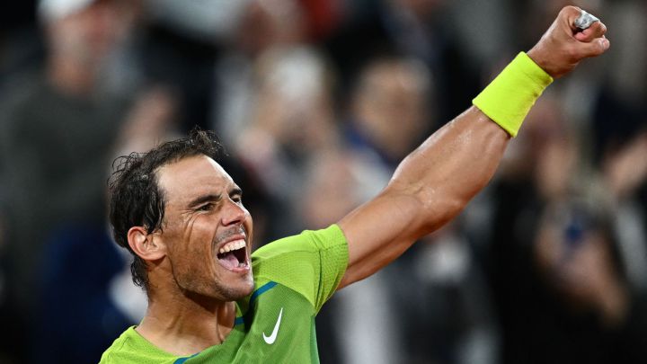 Spain's Rafael Nadal celebrates after winning against France's Corentin Moutet at the end of their men's singles match on day four of the Roland-Garros Open tennis tournament at the Court Philippe-Chatrier in Paris on May 25, 2022. (Photo by Anne-Christine POUJOULAT / AFP)