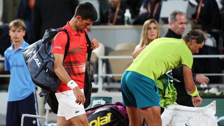 PARIS, FRANCE - MAY 31: Novak Djokovic of Serbia walks off the court after defeat against Rafael Nadal of Spain during the Men's Singles Quarter Final match on Day 10 of The 2022 French Open at Roland Garros on May 31, 2022 in Paris, France.  (Photo by Clive Brunskill/Getty Images)