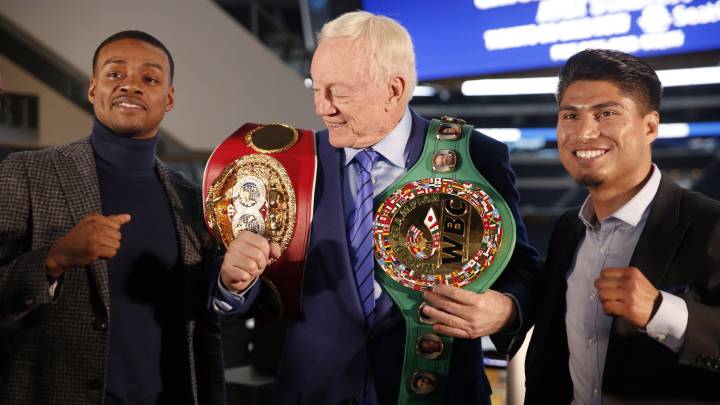 Boxers Errol Spence Jr., left, and Mikey Garcia, right, adorn Dallas Cowboys owner Jerry Jones 