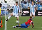 El Málaga gana con polémica y manda al Levante a Segunda